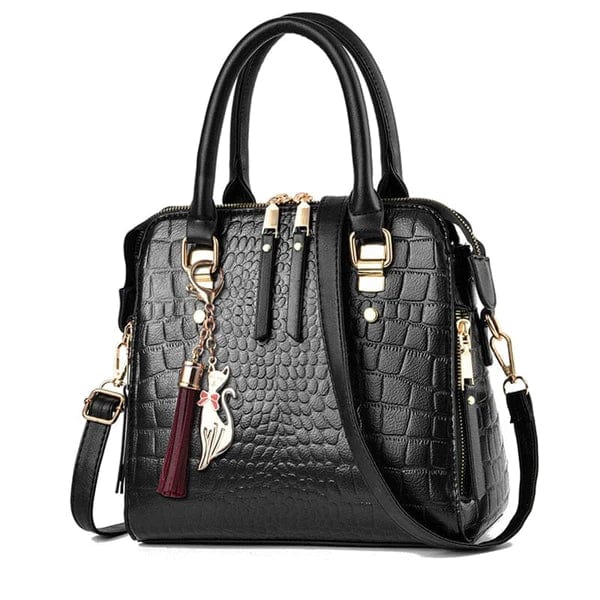 Black crocodile leather handbag with gold hardware, top handles, detachable shoulder strap and tassel charm