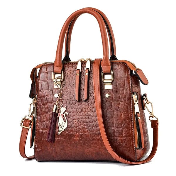 Brown structured crocodile leather handbag with gold hardware top handles detachable shoulder strap and tassel charm