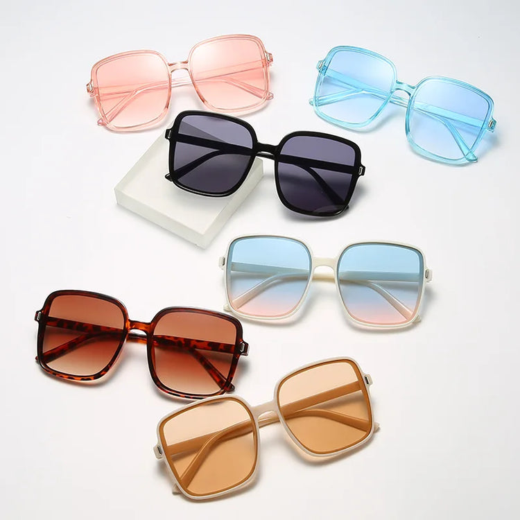 Six oversized square sunglasses in pink blue black tortoiseshell beige and amber on white backdrop summer breeze sunglasses deal