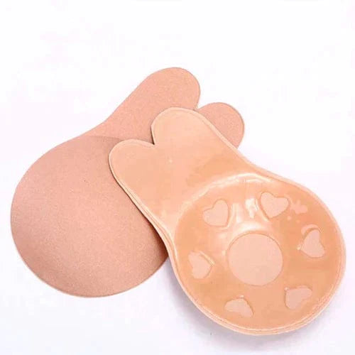 Nude silicone adhesive lifting bra pads with bunny ear tabs and heart shaped adhesive zones for backless outfits