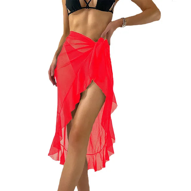 Red sheer summer beach wrap skirt with high side slit and ruffle hem over black bikini