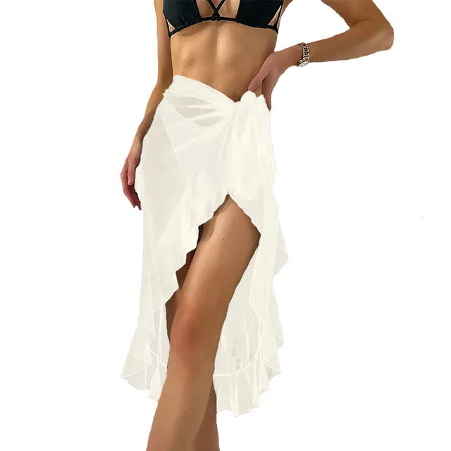 White sheer summer beach wrap skirt tied at hip with high slit and ruffle hem over bikini