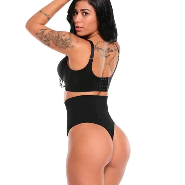 Model wearing black high waist slimming panty thong with matching bra back view showing tattooed shoulders